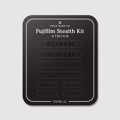Stealth Kit for Fujifilm X-T30 I-II-III: Ghost Logo and Plain Black vinyl labels on the Field Made Co backing sheet